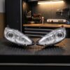 Coppia Fari Anteriori Destro + Sinistro Ford Fiesta 2008-2012 - Parabola Cromata sul banco officina