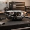 Faro Anteriore Sinistro BMW Serie 1 F20 5 Porte - F21 3 Porte 2012-2014 – Xenon A Led C/Motore Parabola Nera sul banco officina