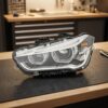 Faro Anteriore Sinistro BMW X1 2015+ Originale Valeo sul banco officina