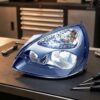 Faro Anteriore Sinistro Renault Clio 2001-2004 - Parabola Nera sul banco officina