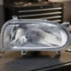 Faro Destro H4 Per Volkswagen Golf Iii 8/91-7/97 ricambio originale Hella sul banco officina