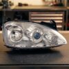 Faro fanale proiettore destro per Opel Corsa C 04>06 sul banco officina